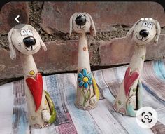 three ceramic dogs sitting next to each other