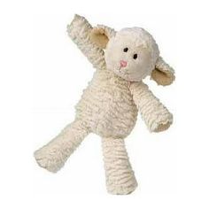 a white stuffed animal that is laying on its back with it's arms in the air