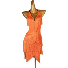 a mannequin wearing an orange dress with fringes