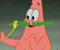 a cartoon character with a mustache and no shirt holding a green leaf in his mouth