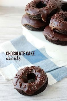 chocolate cake donuts are sitting on top of each other