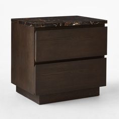 a brown wooden drawer with marble top