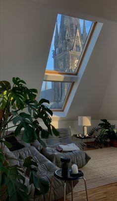 a living room filled with furniture and a skylight