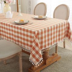 PRICES MAY VARY. Classic Gingham Tablecloth: Features the classic buffalo checkered pattern in orange and white to create the best farmhouse look, edged in jaunty tassels for a refined finish and playful touch to your decor! Rustic in appearance that suits farmhouse, rustic, or modern decor styles, and will instantly lift the mood of anyone who comes to eat with you Tassel edge design: The linen tablecloth with delicate checked patterns and beautiful fringe tassel gives you a decent elegant feel Buffalo Plaid Fall Table, Fall Table Cloth, Dining Room Orange, Thanksgiving Table Cover, Fall Tablecloth, Thanksgiving Tablecloth, Gingham Tablecloth, Checkered Tablecloth, Plaid Tablecloth