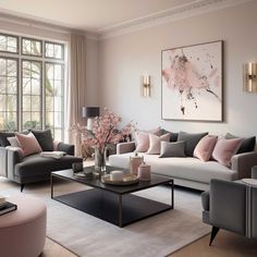 a living room filled with lots of furniture and pink pillows on top of the couches