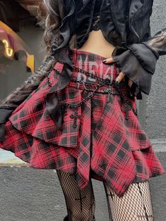 Embrace the Y2K fashion trend with this edgy and unique punk plaid skirt. Featuring a high-waisted A-line silhouette and an irregular hem, this skirt exudes a cool and alternative vibe. Perfect for the summer season, this standout piece is a must-have for those who love to express their individual style.  Please note that this product includes only the skirt or a set.  Garment Size   	 		 			Size 			S 			M 			L 		 		 			Waist 			63 			67 			71 		 		 			Full Length 			35 			36 			37 Emo Skirt For Alternative Fashion, Punk Mini Skirt For Streetwear, Punk Style Mini Skirt For Streetwear, Punk Streetwear Mini Skirt, High Waist Punk Skirt For Alternative Fashion, High Waisted Punk Skirt For Alternative Fashion, Gothic Streetwear Skirt For Spring, Punk Streetwear Skirt For Fall, Fall Grunge High Waist Mini Skirt