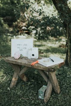 a picnic table with food on it and a sign that says, you're the little one