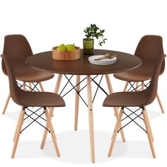 a round table with four chairs and a bowl of fruit on the top is shown