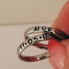 "These Stainless Steel rings are super shiny and a petite 3 mm wide, with a rounded edge. The letters y, p, and j do NOT do well on this rounded ring therefore I suggest if you have these letters in your name that you order the 3 mm flat ring available on my page. These rings are comfortable for stacking up to 4 rings. I can personalize with names, dates, quotes or roman numerals or scripture. Great to wear with your diamond or use as a thumb ring also. These rings also come in Gold and Rose Gol Name Rings Personalized, Name Rings Silver, Dates Quotes, Flat Ring, Hand Stamped Ring, Small Quotes, Mom Ring, Name Ring, Stamped Rings