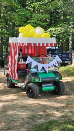 a golf cart with balloons on the back