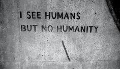 graffiti on the side of a building that says i see humans but no humanity