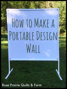 a sign that says how to make a portable design wall in front of some grass