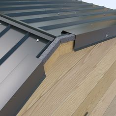 a close up view of a metal roof with wood shingles on the top and bottom