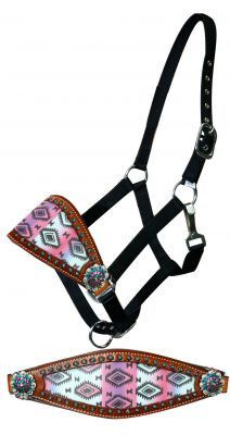 a pink and black horse bridle with an intricate design on the front, back and sides