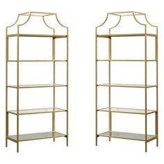 two gold metal shelvings with glass shelves