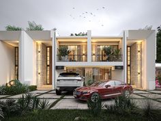 two cars parked in front of a modern house