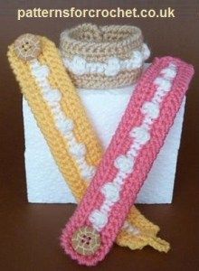 three crocheted items are sitting on top of each other