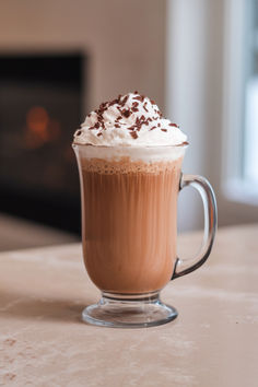 a cup of hot chocolate with whipped cream on top