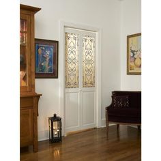 a living room with wood floors and white walls