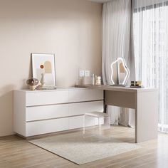 a white desk sitting in front of a window next to a chair and table with a mirror on it