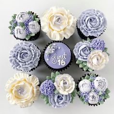 a bunch of cupcakes with frosting and flowers on them are arranged in a circle