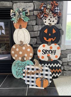 several pumpkins are on display in front of a fireplace