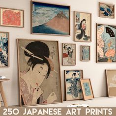 there are many japanese art prints on the wall