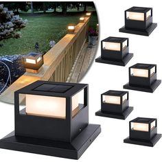 five solar powered lights on top of a wooden deck in front of a garden area