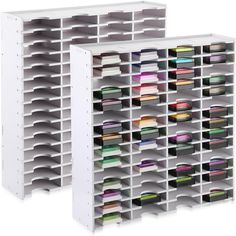 two white shelving units with bins filled with various colored papers and folders