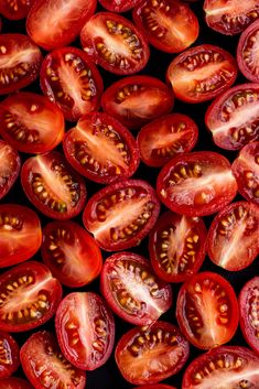 many pieces of tomatoes are shown in this close up photo, with the seeds still attached