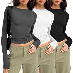 PRICES MAY VARY. Soft Material: Womens tight long sleeve shirts is made of high quality polyester fabric. Soft and elastic, lightweight and Comfortable to wear. Cute Design: Cropped and stretch fitted style,crew neck, tight underscrubs layer,you can wear it regularly or fold it up like a crop top,cute,slim fit,casual y2k style fashion 2024. Matching: This womens long sleeve tops, tunic tops to wear with leggings, your favourite jeans, hat, With a necklace, Sunglasses, Up with heels or sneakers f Black Undershirt, Basic Crop Tops, Knit Shirts, Fit Y2k, Collared Shirts, Black Shirts, Hoodie Streetwear, Compression Shirt, Plain Shirts