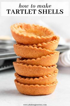 a stack of mini pies sitting on top of a counter