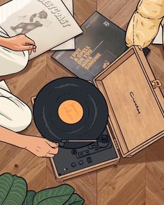 a record player sitting on top of a wooden floor