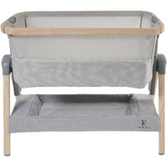 a baby crib that is made out of wood and grey fabric, with the seat up