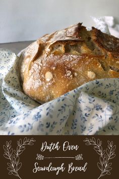 a loaf of bread sitting on top of a blue and white cloth