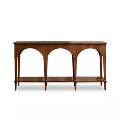 a wooden console table with three shelves on one side and an oval design on the other