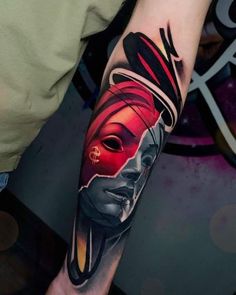 a person with a tattoo on their arm that has a woman's face painted on it