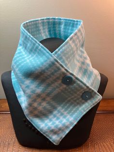 Hand sewn with love is this warm & comfortable aquamarine green plaid neck warmer scarf with two buttons that will keep you warm during the cold winter months.   This  scarf can be worn under a coat to go out in or as a decorative accessory to your daily work attire.   Neck warmers make a great alternative to a bulky scarf.   Each neck warmer scarf is individually handmade with close attention to detail and I select only high quality fabrics that will work for the item I am making. I work in a s Poncho Pattern Sewing, Bulky Scarf, Fleece Projects, Neck Warmers, Fleece Scarf, Scarf Neck, Poncho Pattern, Pattern Sewing, Sewing Projects For Beginners