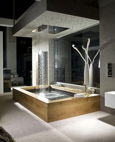 a bathroom with a large bathtub next to a window