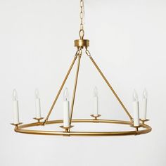 a chandelier with six candles hanging from it