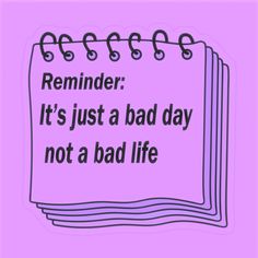 a notepad with the words reminder it's just a bad day not a bad life