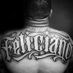 a man's back with the word tattoo on it