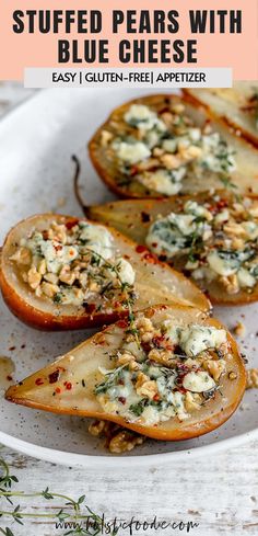 baked stuffed pears with blue cheese on a white plate and text overlay that reads stuffed pears with blue cheese easy, gluten - free appetizer