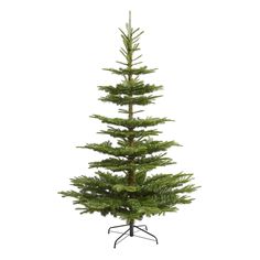 a small pine tree sitting on top of a metal stand