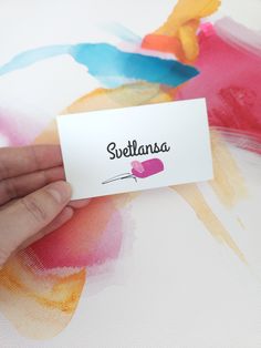 someone is holding up a business card with the word sulflansa on it