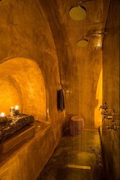 a bath room with a large tub next to a sink and a shower head mounted on the wall