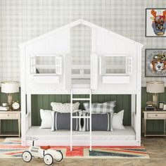 a white bunk bed sitting on top of a wooden floor