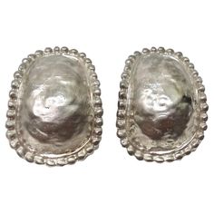 Make a statement with these incredible 1980s sterling silver stud earrings. Oval clip-on studs are adorned in a textured sterling silver with a dome-like structure surrounded by circular engravings. These are such a classic and versatile style of earring, ideal for any occasion as you can dress them up or down to your liking. Style these with a silver Chanel handbag and a vintage Missoni dress for a timelessly chic look. In excellent vintage condition, please see photos. Silver Earrings Vintage, Vintage Earrings Silver, Missoni Vintage, Vintage Missoni, Vintage Silver Earrings, Missoni Dress, Silver Jewlery, Vintage Silver Jewelry, Clip On Earring