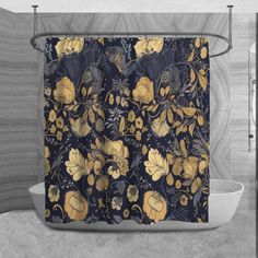 the shower curtain is decorated with gold and black flowers on a dark blue background,