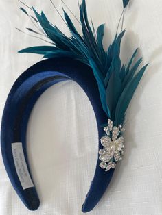 Distinctive teal feather navy  blue padded velvet headband fascinator with matching feathers. completed with diamnte embellishments. Great for your wedding , celebration or ladies day. Navy Blue Fascinator, Blue Fascinator, Padded Headband, Velvet Headband, Wedding Celebration, Chic Accessories